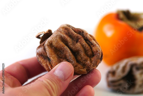Obraz na płótnie Dried persimmon,Dried persimmon is a nutritious, vitamin-rich, mineral-rich and sweet dried fruit variety w salonie