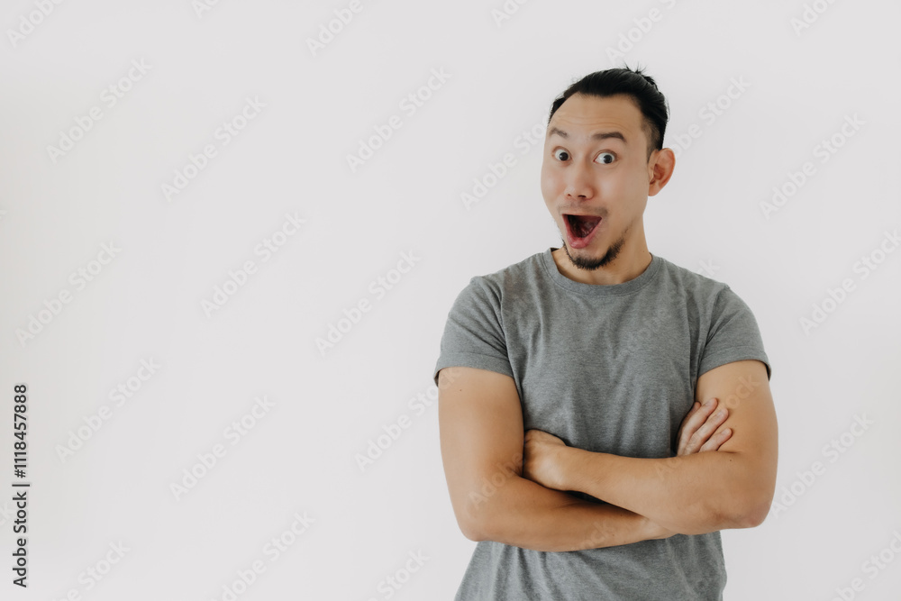 Wow and happy face of Asian man in grey t-shirt isolate on white. Wow and happy face of Asian man in grey t-shirt isolate on white.