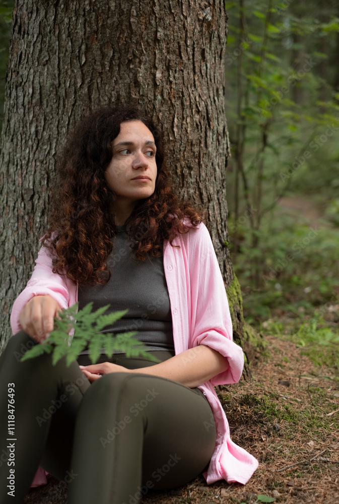 Woman relaxing by tree, harmony Woman relaxing by tree, harmony