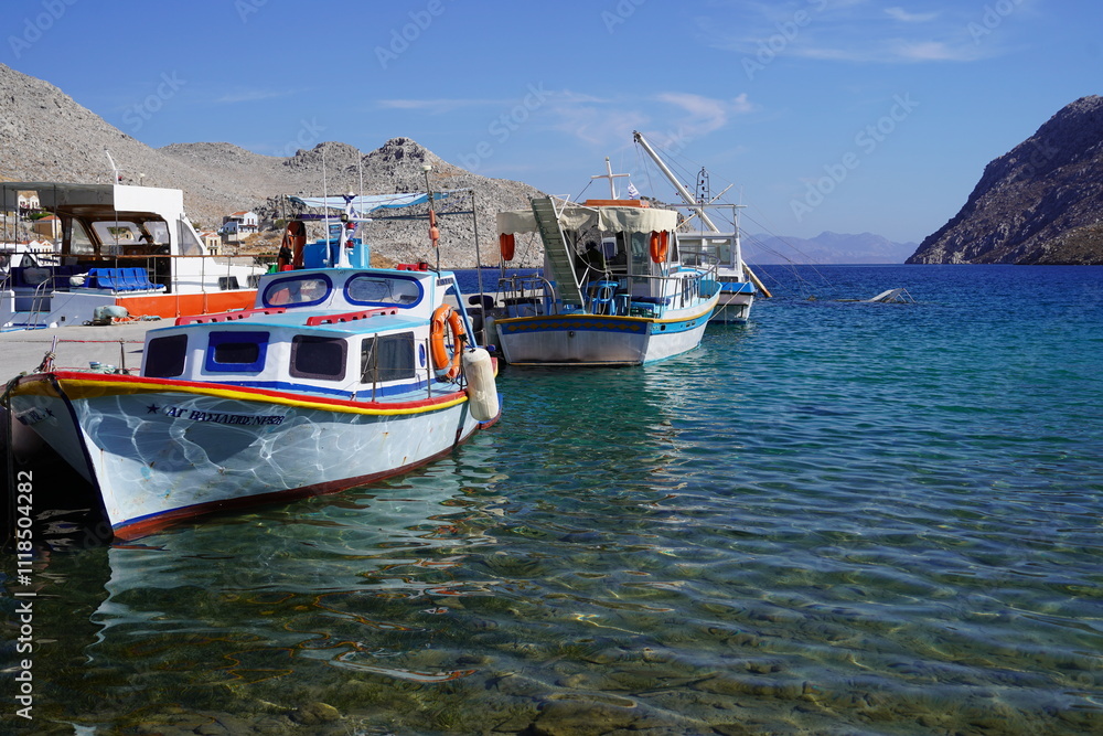 boats in the picturesque and beautiful waters of Symi island marina boats in the picturesque and beautiful waters of Symi island marina