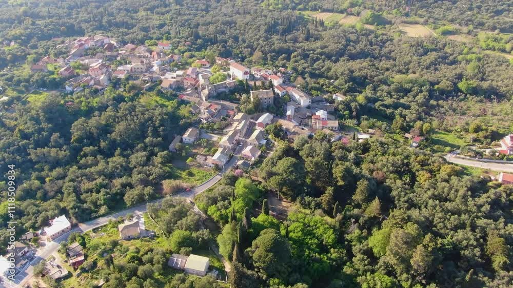 Aerial view of a quaint village nestled amidst lush greenery. Aerial view of a quaint village nestled amidst lush greenery.