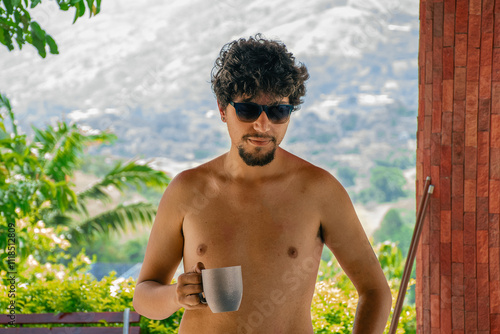 Young man drinking coffee photo