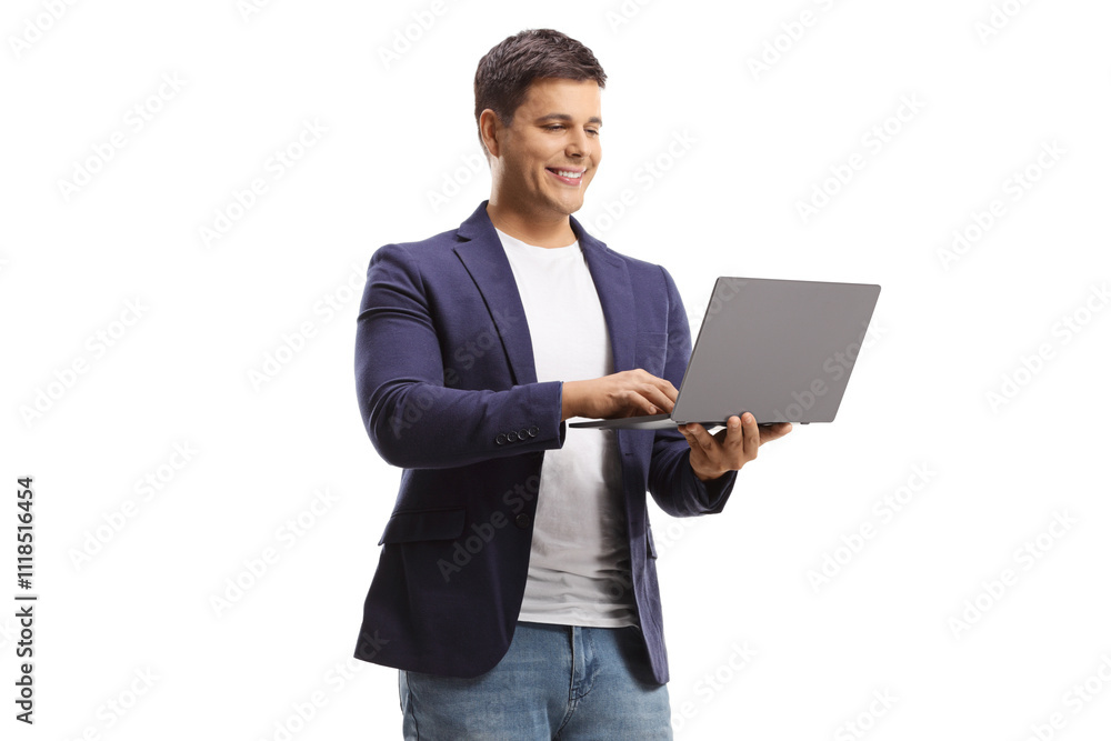 Man standing and working on a laptop computer Man standing and working on a laptop computer