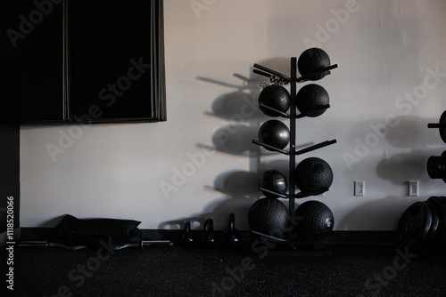 Minimalist Gym Interior Featuring Workout Equipment and Shadow Play