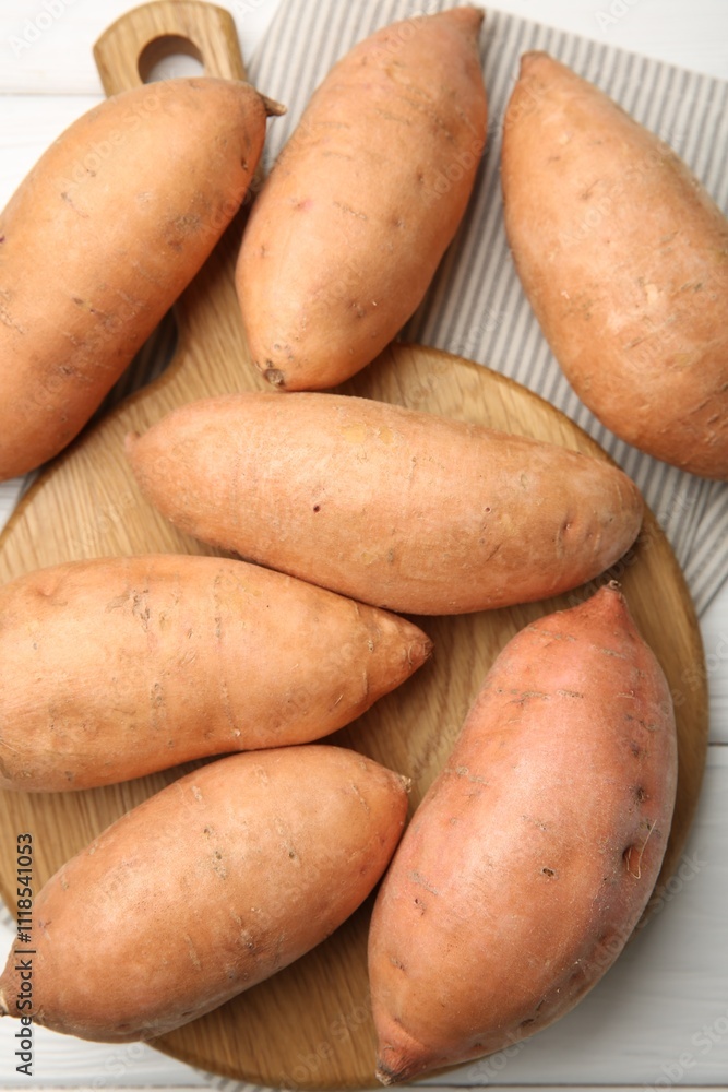 Fresh raw sweet potatoes on white wooden table, top view Fresh raw sweet potatoes on white wooden table, top view