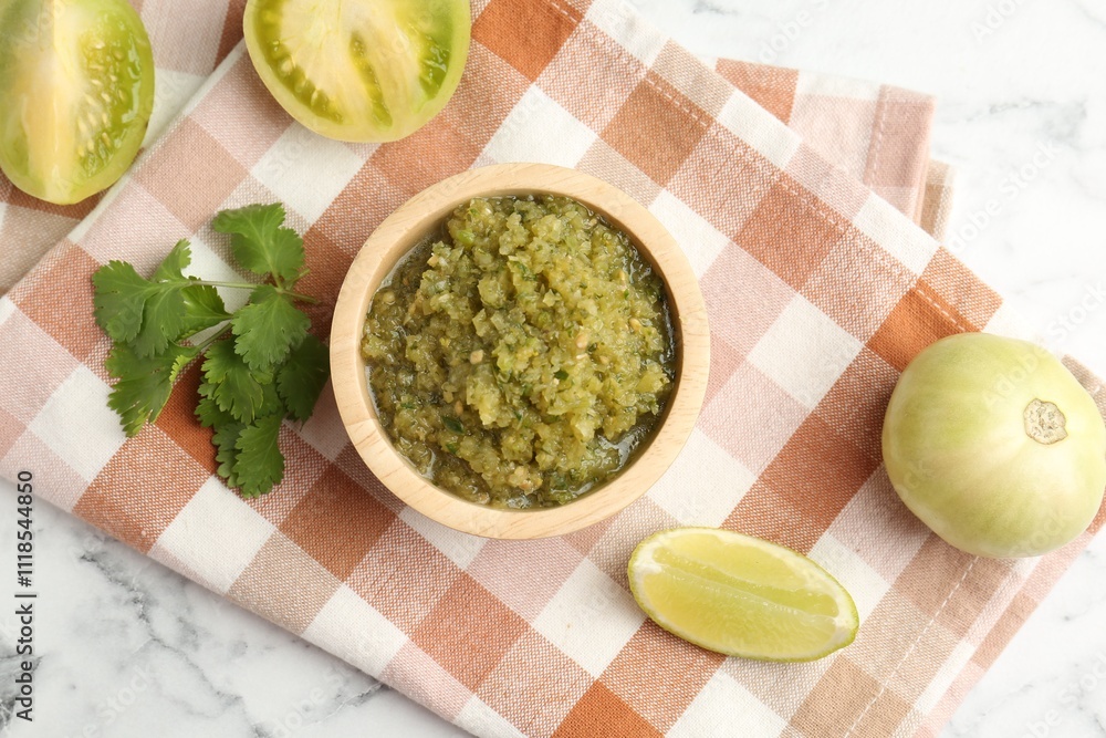 Spicy salsa and ingredients on white marble table, flat lay Spicy salsa and ingredients on white marble table, flat lay