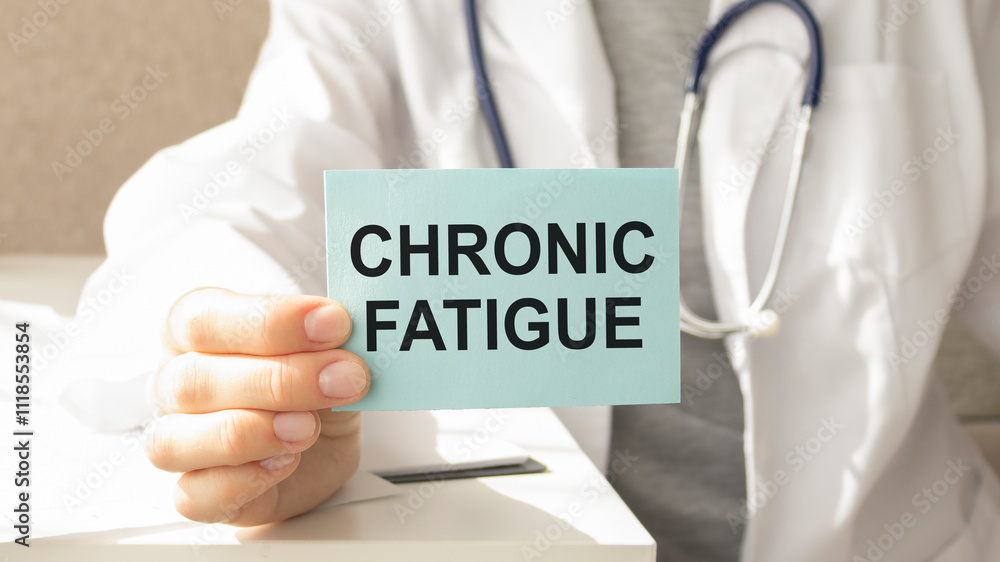Doctor holding sign with text CHRONIC FATIGUE closeup. Doctor holding sign with text CHRONIC FATIGUE closeup.