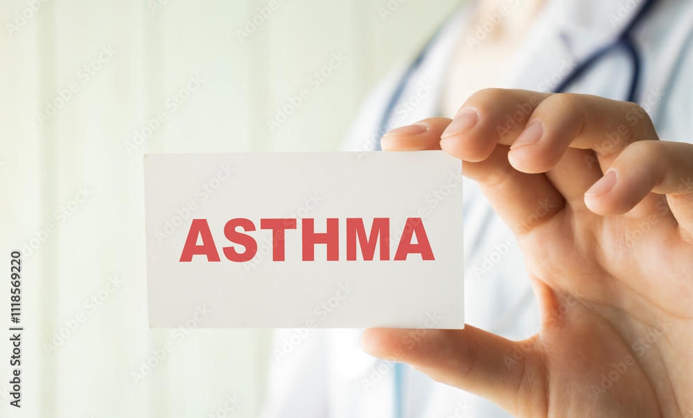 Doctor holding a card with text ASTHMA, medical concept Doctor holding a card with text ASTHMA, medical concept