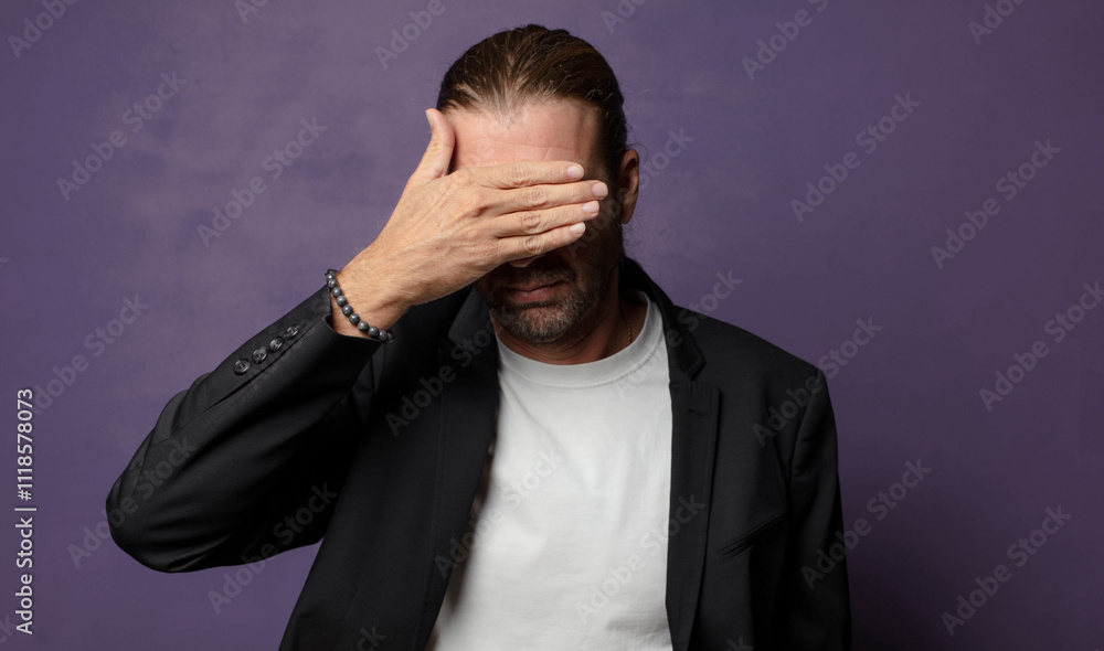covering eyes with one hand feeling scared or anxious, wondering or blindly waiting for a surprise covering eyes with one hand feeling scared or anxious, wondering or blindly waiting for a surprise