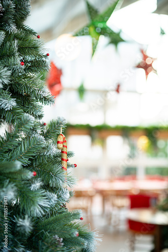 Merry x-mas,Close up of Colorful balls ,gifts box and Christmas greeting picture parcel,bell decoration on Green Christmas tree background Decoration During Christmas and New Year.