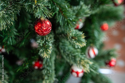 Obraz na płótnie Merry x-mas,Close up of Colorful balls ,gifts box and Christmas greeting picture parcel,bell decoration on Green Christmas tree background Decoration During Christmas and New Year. w salonie
