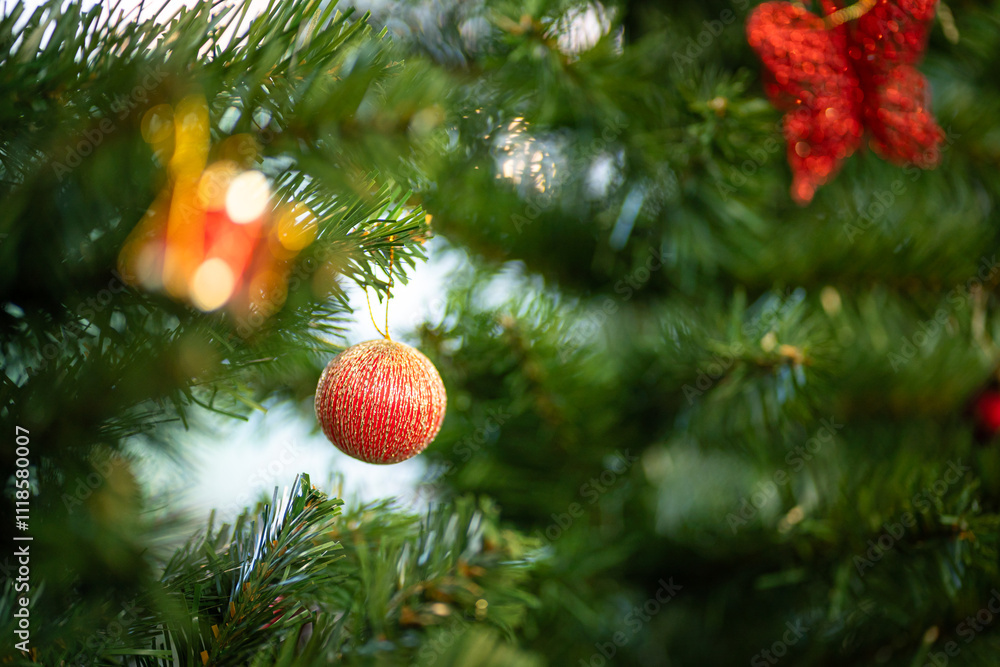 Merry x-mas,Close up of Colorful balls ,gifts box and Christmas greeting picture parcel,bell decoration on Green Christmas tree background Decoration During Christmas and New Year.