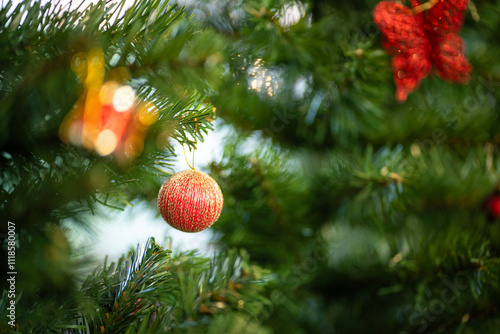 Obraz na płótnie Merry x-mas,Close up of Colorful balls ,gifts box and Christmas greeting picture parcel,bell decoration on Green Christmas tree background Decoration During Christmas and New Year. w salonie