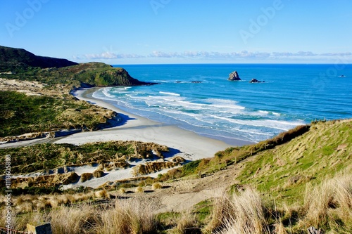 Sandfly Bay, Otago Peninsula. It is a sandy bay with large dunes 15 kilometres east of central Dunedin, New Zealand.