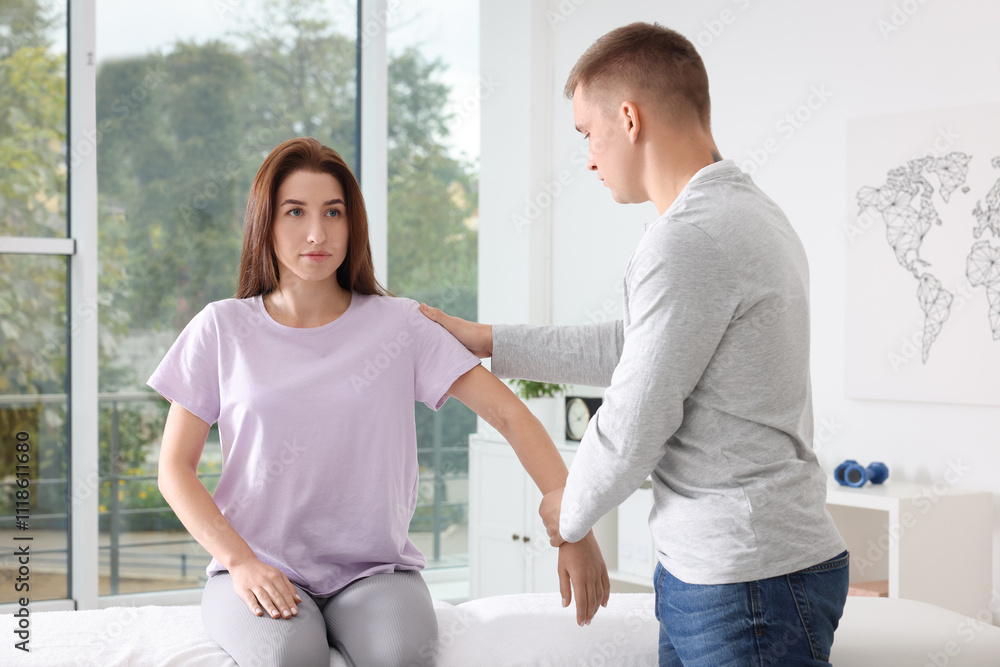 Fototapeta premium Osteopath working with patient in clinic. Manual therapy