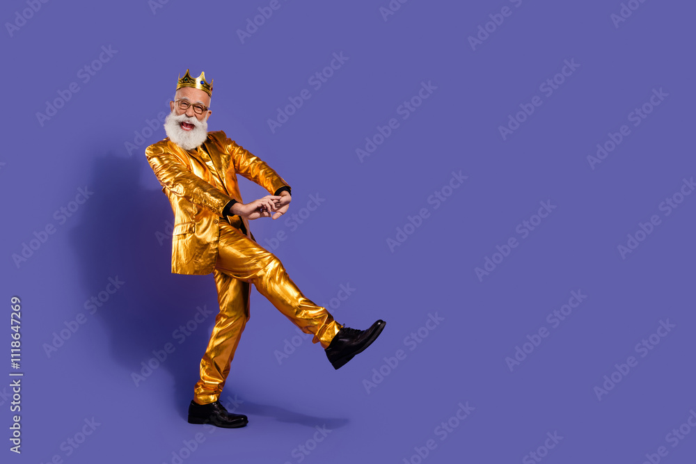 Full body portrait of funny eccentric man clubbing dancing golden shiny suit isolated on purple color background Full body portrait of funny eccentric man clubbing dancing golden shiny suit isolated on purple color background