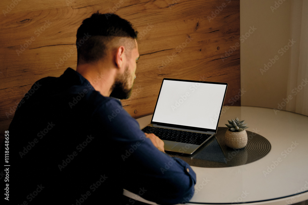 custom made wallpaper toronto digitalWhite mock up image blank screen laptop with copy space background for advertising text. Young freelancer man using laptop on kitchen table at home. Marketing and creative design concept.