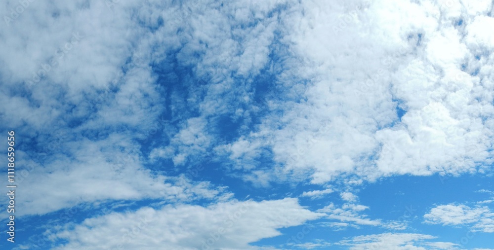 Blue sky with white clouds - natural air space panorama. Topics: weather, meteorology, atmosphere, nature, background