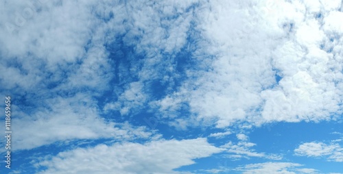 Blue sky with white clouds - natural air space panorama. Topics: weather, meteorology, atmosphere, nature, background