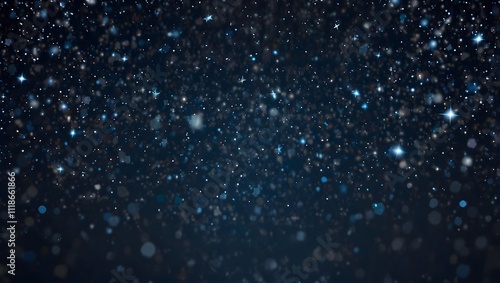 Many tiny, light blue specks are scattered against a dark blue background.