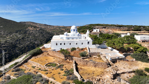 Aerial drone photo of Monastery of Panagia Vouno overlooking famous beach of Platy Gialos, Sifnos island, Cyclades, Greece photo