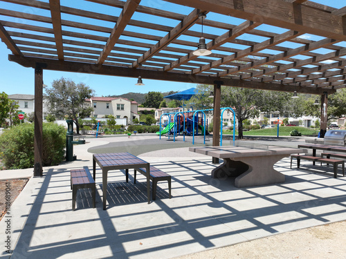 Covered gathering area in community park with picnic tables, Escondido, San Diego, California