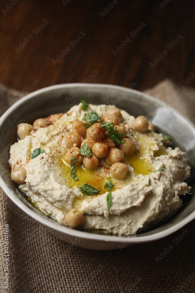 Close-up of a bowl of Spicy chipotle hummus with chickpeas