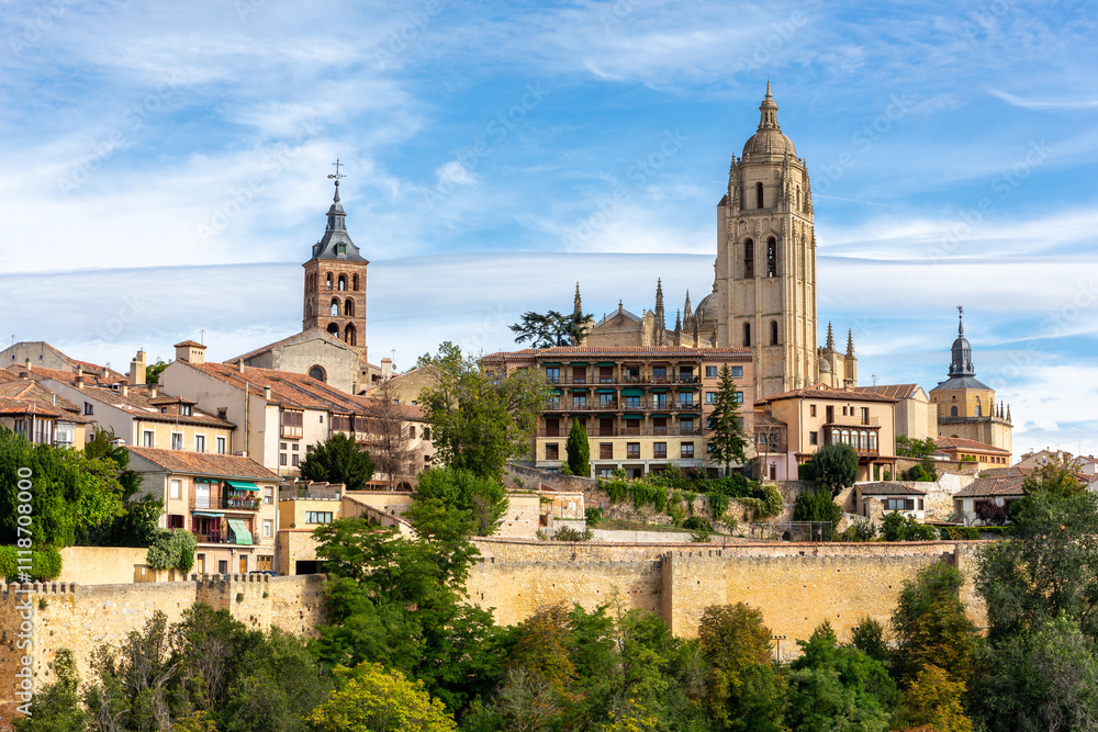 Fototapeta premium Segovia, Spain skyline with Segovia Cathedral at the top, churches, medieval architecture, residential buildings and city walls.