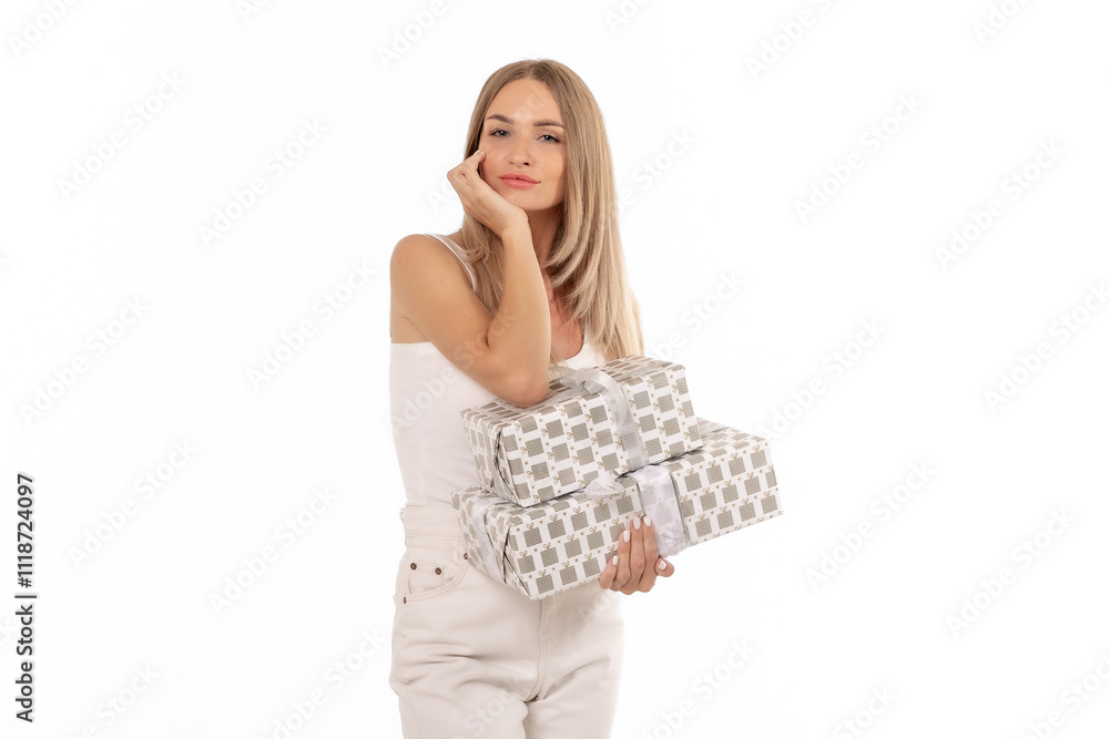 Young woman holding beautifully wrapped gifts against a plain background, showcasing a thoughtful expression and festive spirit Young woman holding beautifully wrapped gifts against a plain background, showcasing a thoughtful expression and festive spirit