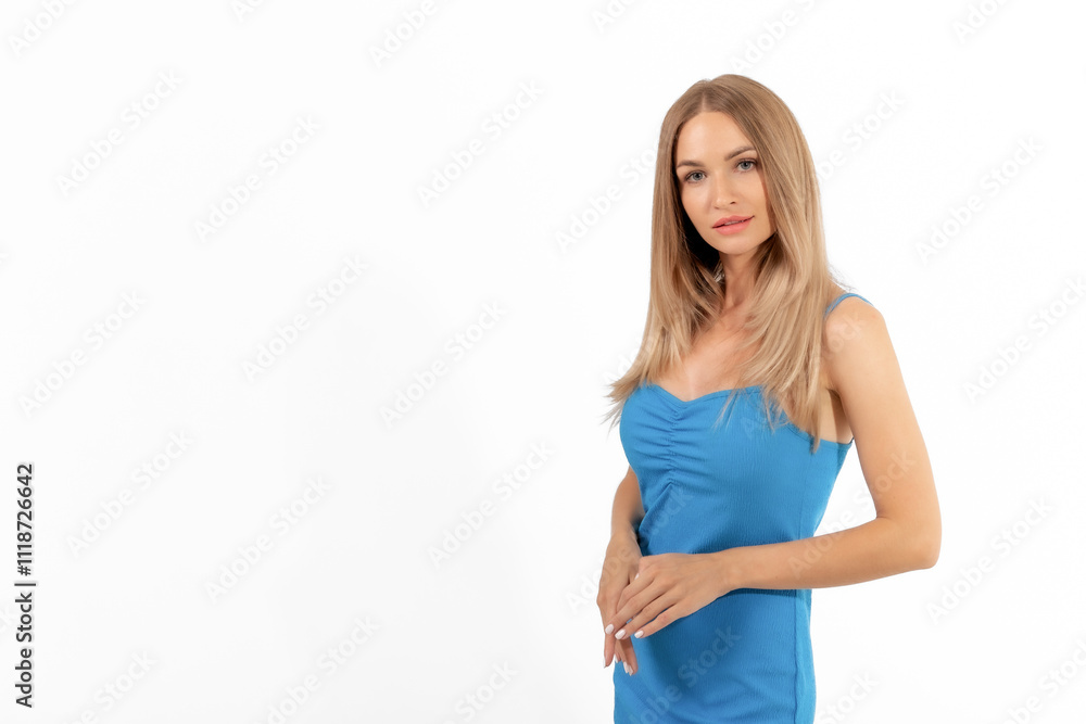A young woman poses confidently in a blue dress against a clean, white background showcasing her style and poise A young woman poses confidently in a blue dress against a clean, white background showcasing her style and poise