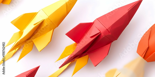 Colorful origami paper rockets, featuring red and yellow designs, inspiring creativity photo