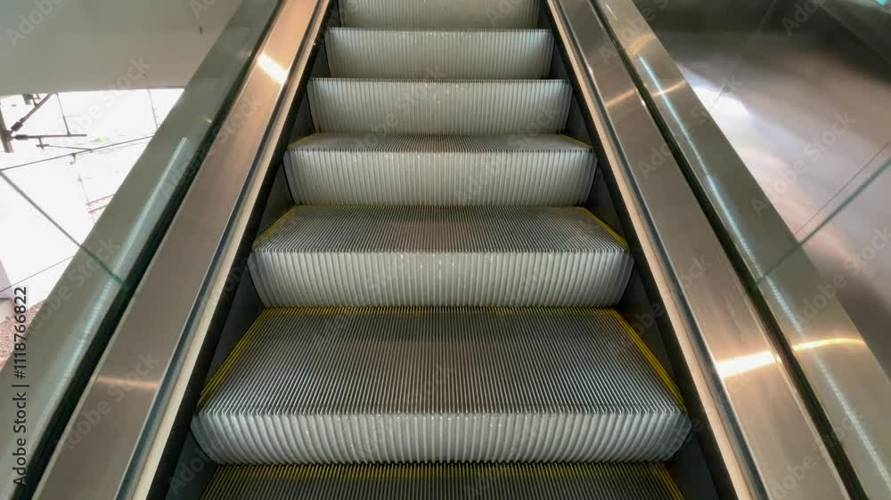 First Person POV empty moving up escalator on public place, Low angle shot of escalator. escalator steps moving up, close up view of steps. First Person POV empty moving up escalator on public place, Low angle shot of escalator. escalator steps moving up, close up view of steps.