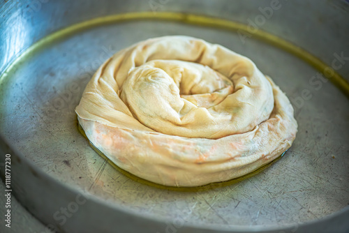 Elderly Woman Rolling Out Dough photo