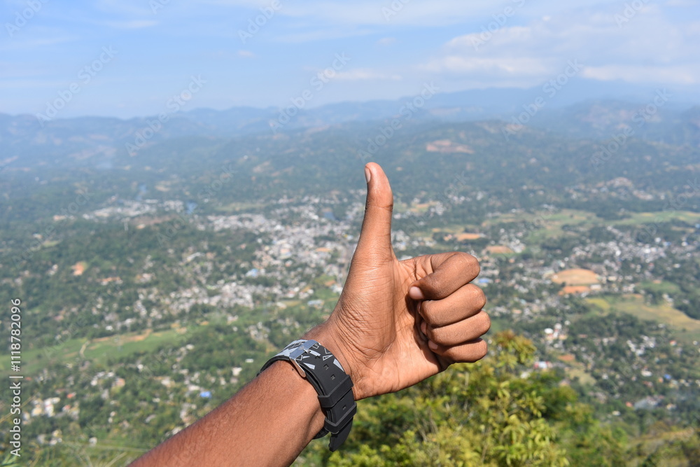 thumb up in the mountains