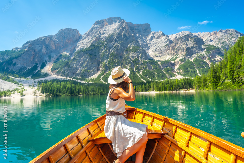 Tourist enjoying a sunny day at lake braies in the italian dolomites Tourist enjoying a sunny day at lake braies in the italian dolomites