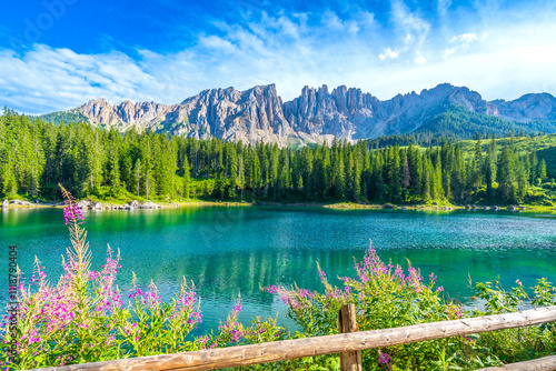 Fototapeta Naklejka Na Ścianę i Meble -  Karersee lake reflecting latemar mountain range in the dolomites on a clear summer day