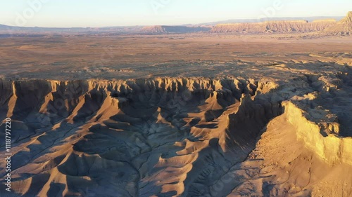 Aerial photo of Moonscape Overlook just after sunrise with the Henry Mountains in the distance near Factory Butte and Hanksville, Utah.