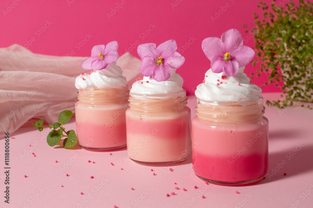 Pink cream with whipped cream and violets. Sweet love food Pink cream with whipped cream and violets. Sweet love food