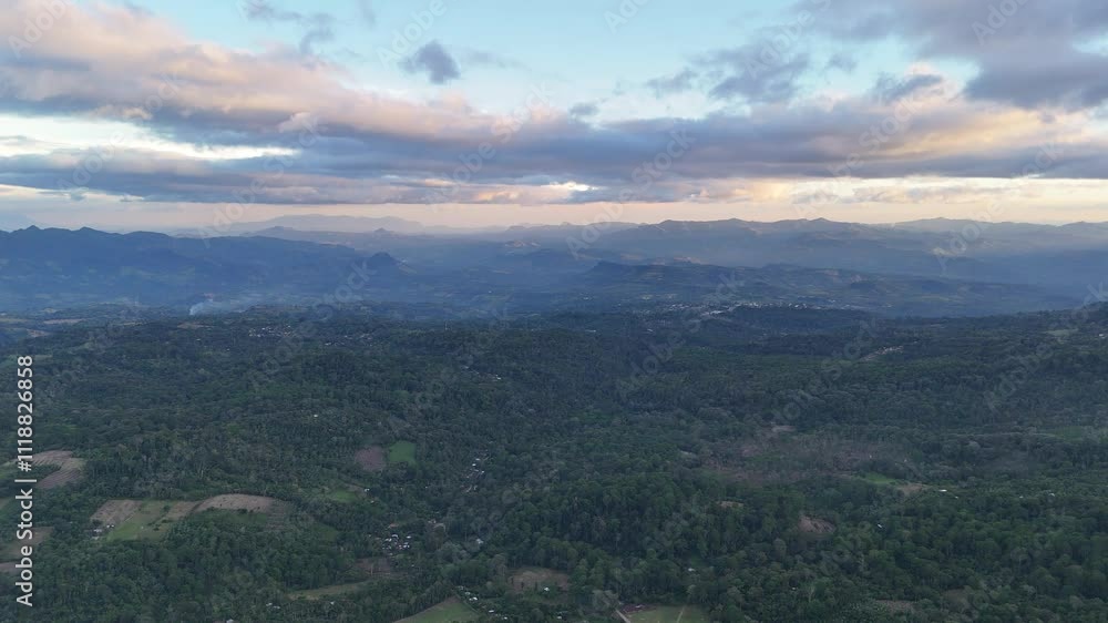 Breathtaking view of verdant mountains under cloudy sky as dusk approaches in Nicaragua, offering tranquil atmosphere Breathtaking view of verdant mountains under cloudy sky as dusk approaches in Nicaragua, offering tranquil atmosphere