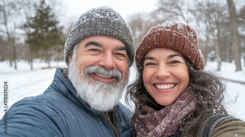 A Smiling Couple In Winter Clothing Covered In Snow