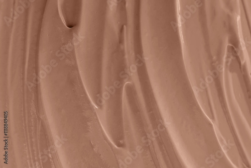 Vászonkép Creamy chocolate mixture swirled smoothly on a surface close-up, mocha mousse co