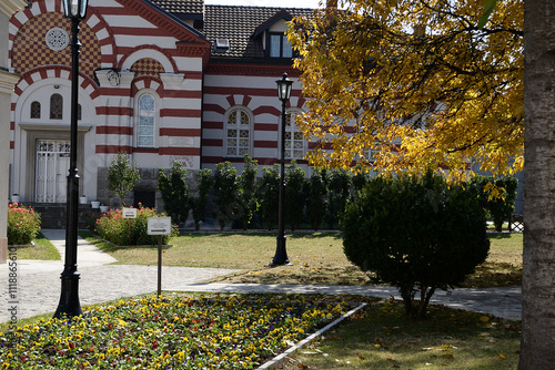 October 6, 2018 - Belgrade, Serbia. The church in the gate of the Rakovica Monastery with a part of the courtyard and the tombstones of His Holiness the Patriarch of the Serbian Gentleman Pavle  photo