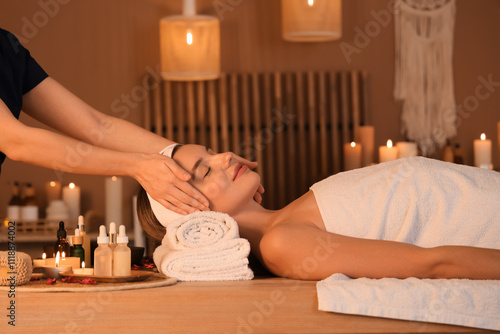 Young woman getting facial ...