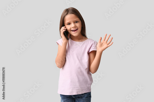 Happy little girl talking b...