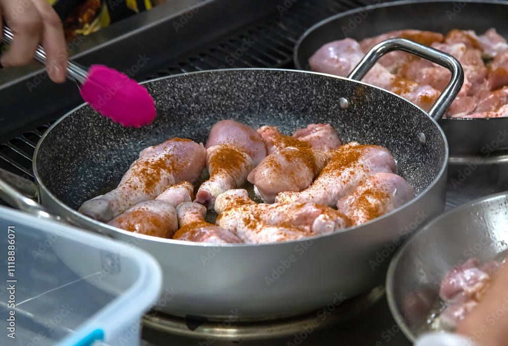 Pans with chicken meat stand on the stove, frying chicken, cooking, real picture in the kitchen Pans with chicken meat stand on the stove, frying chicken, cooking, real picture in the kitchen