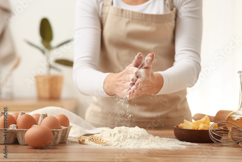Woman preparing dough with ...