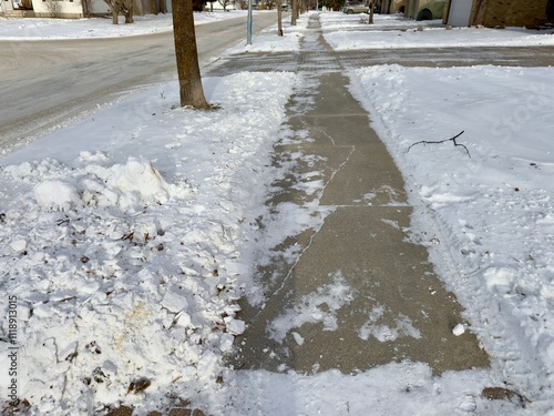 winter sidewalk cleared of snow