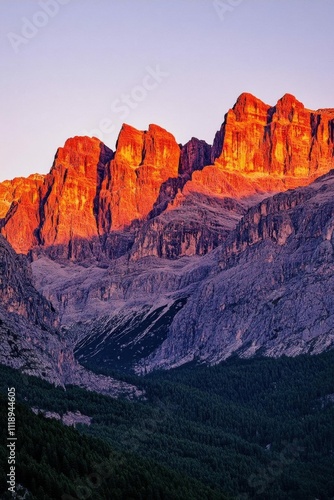 Majestic mountains illuminated by sunset, showcasing nature's beauty.