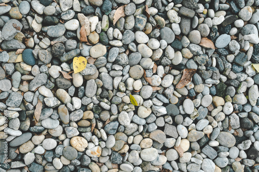 Pebble stone texture on the ground. The pebbles closely stone texture features. Pebble stone texture on the ground. The pebbles closely stone texture features.
