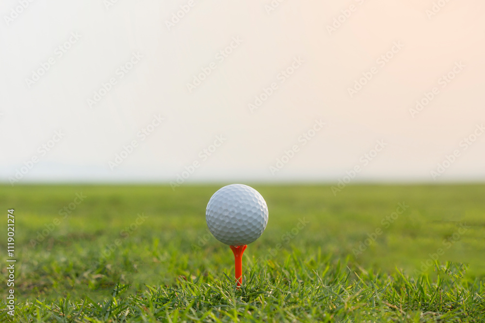 golf ball on tee in a beautiful golf course with morning sunshine. golf ball on tee in a beautiful golf course with morning sunshine.